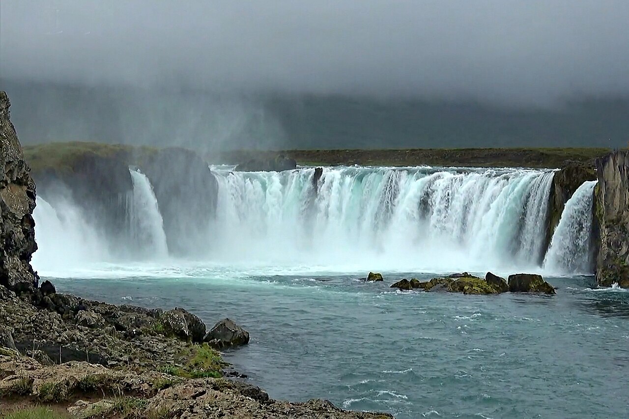 Goðafoss waterfall in North Iceland with a sweeping horseshoe cascade